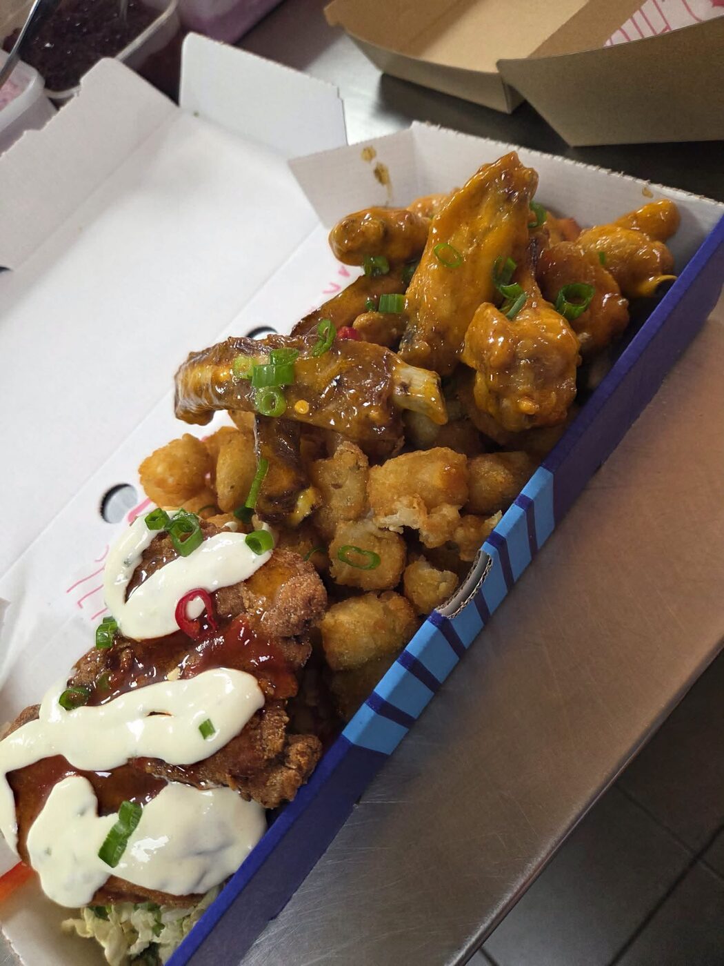Loaded fries topped with chilli beef, cheese sauce, crispy onions, spring onion and fresh chilli